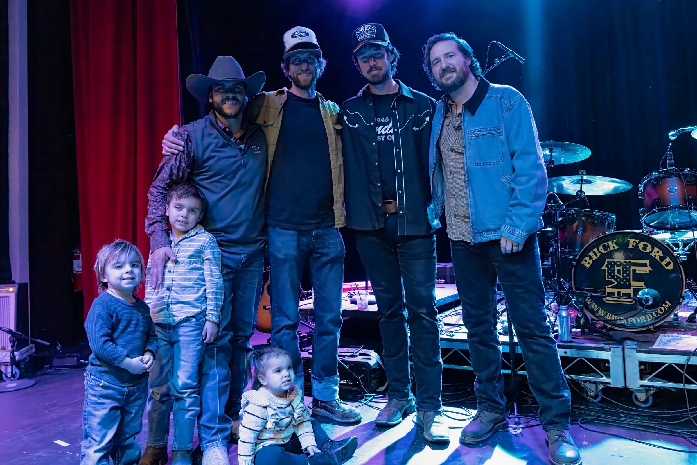 Buck Ford posing with concertgoers after the show